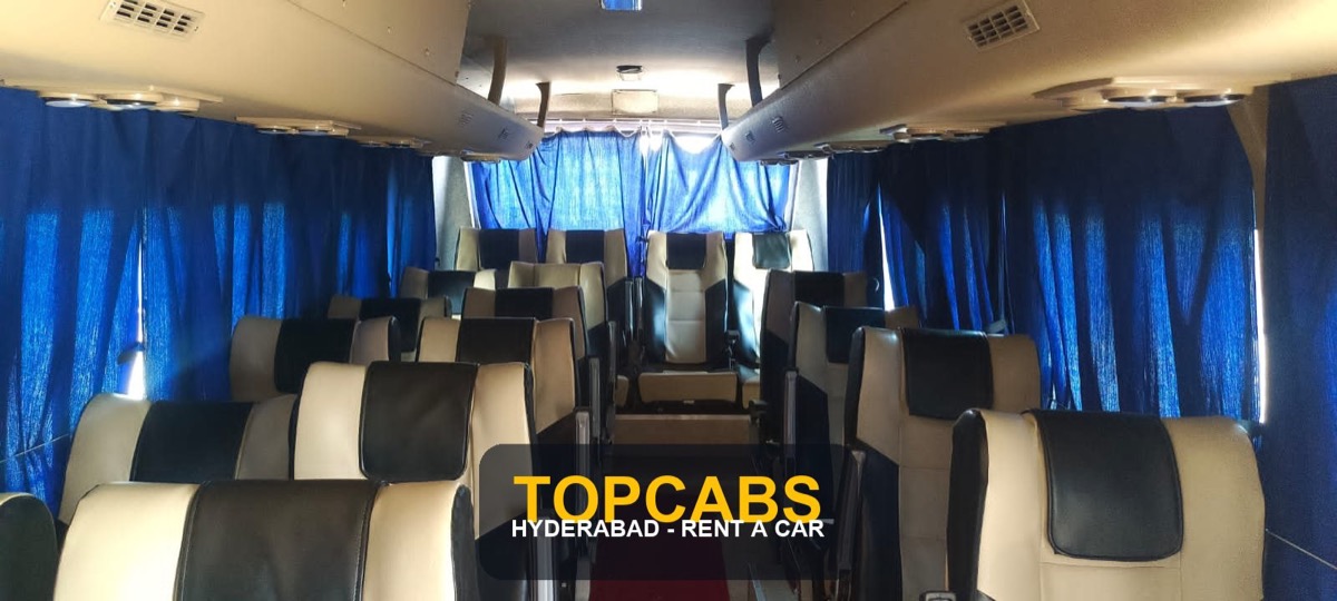 Watermarked TopCabs 22-seater AC coach interior for Hyderabad group travel