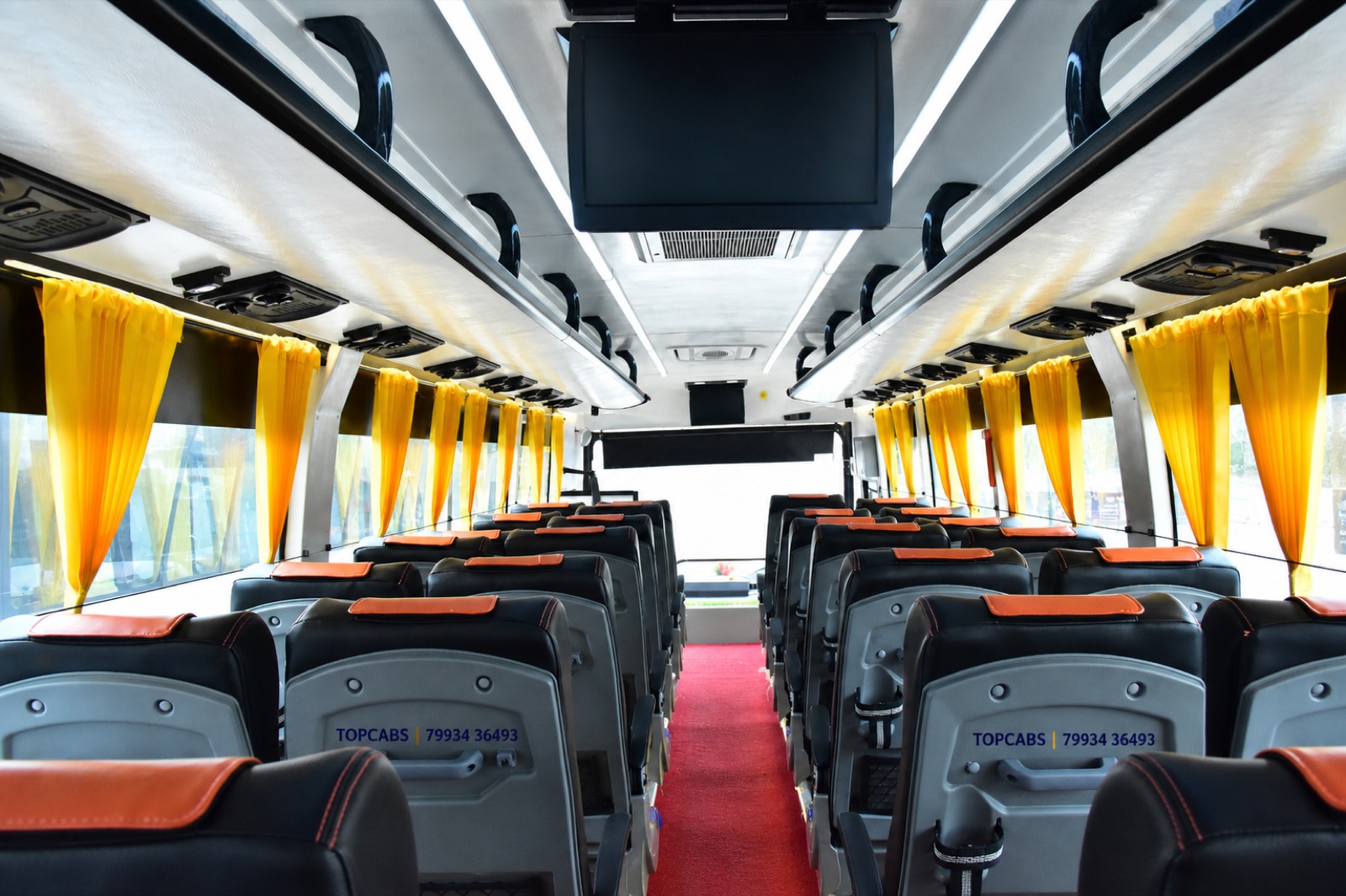 TopCabs 50-seater AC coach interior for group travel