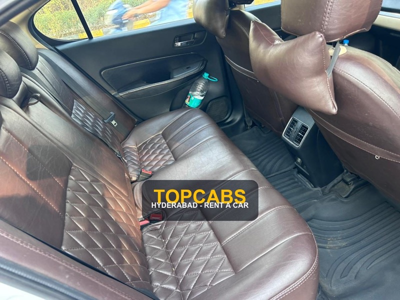 TopCabs Honda Amaze premium sedan rear cabin interior